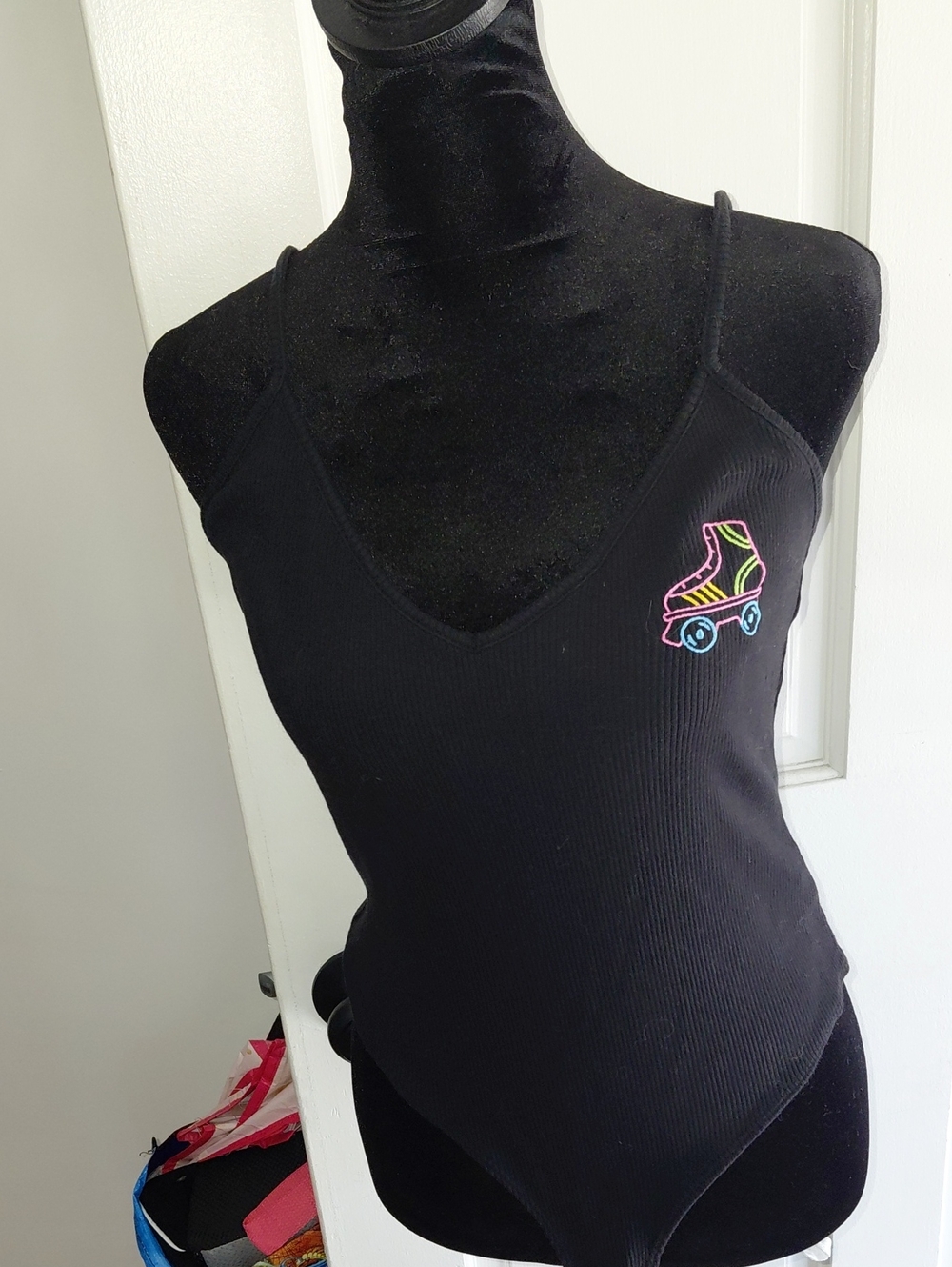 Forever 21 Black Ribbed V-Neck Bodysuit with Neon Roller Skate Patch